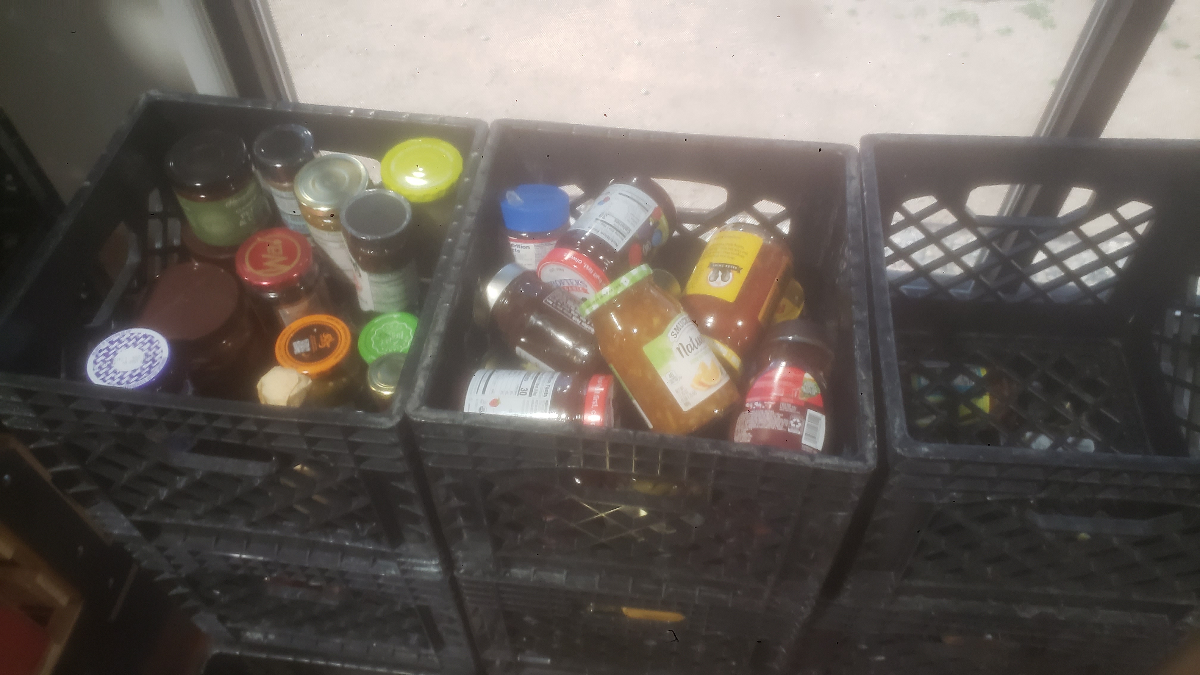 Crates full of glass jars.